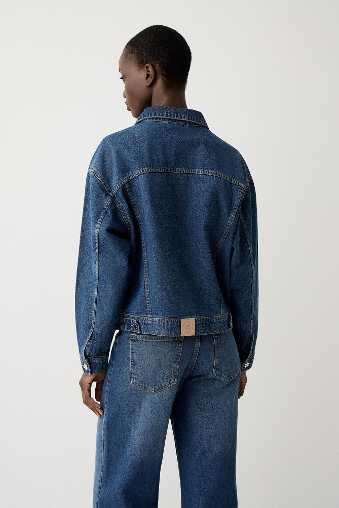 Denim jacket with decorative pins