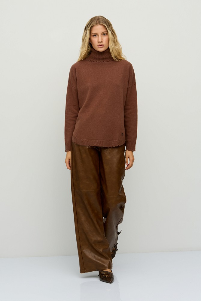 Wool turtleneck sweater with distressed details