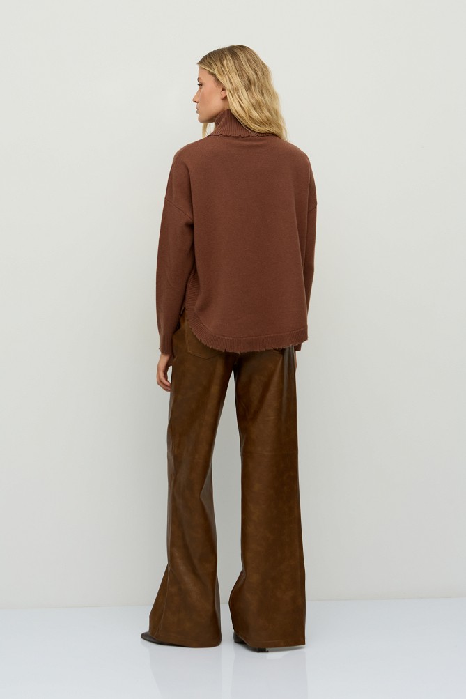 Wool turtleneck sweater with distressed details