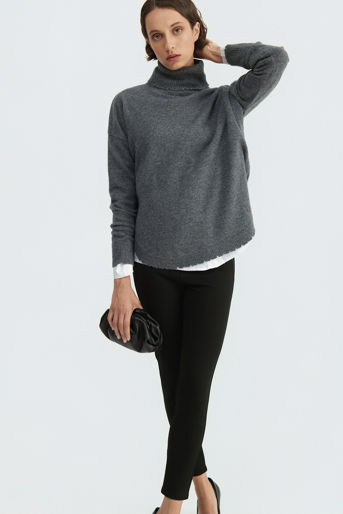 Wool turtleneck sweater with distressed details