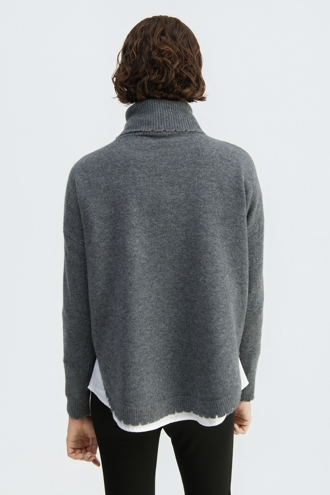 Wool turtleneck sweater with distressed details