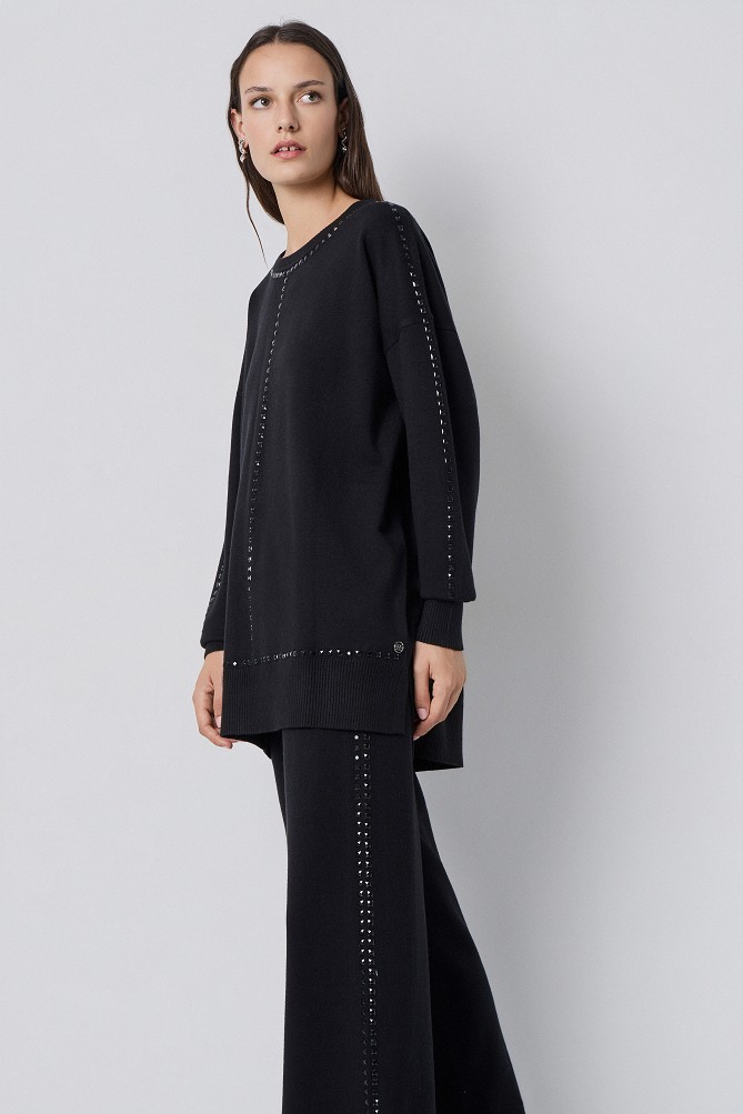 Sweater with decorative studs