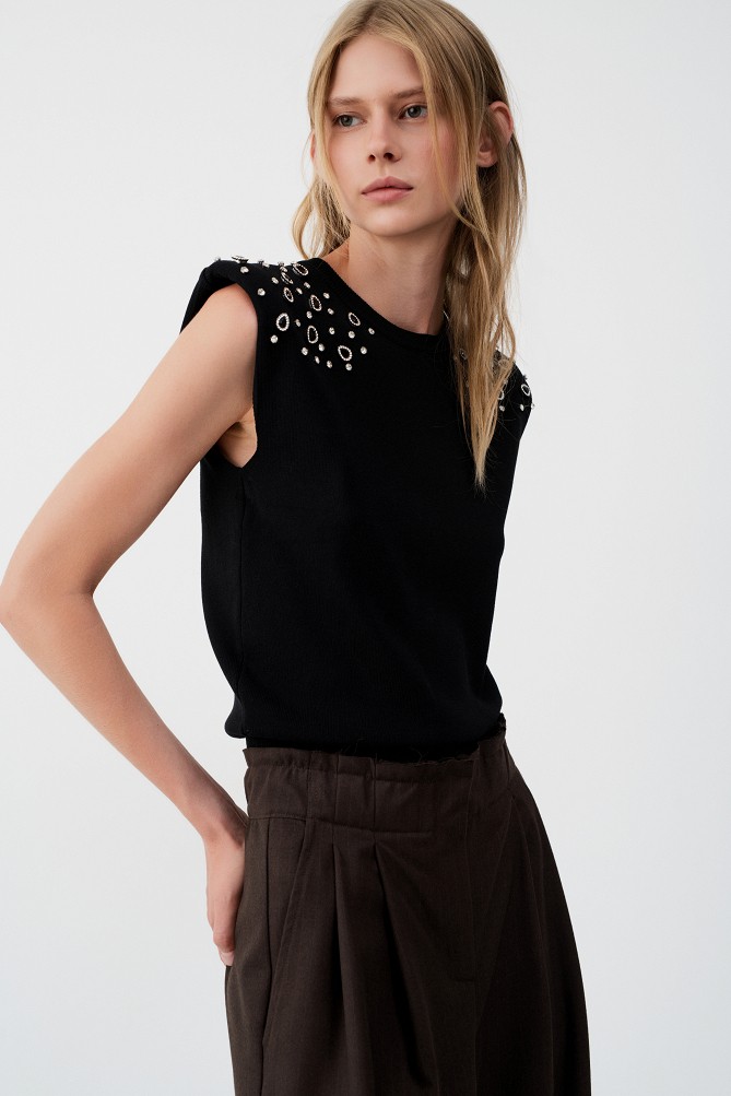 Sleeveless sweater with rhinestone embellishments