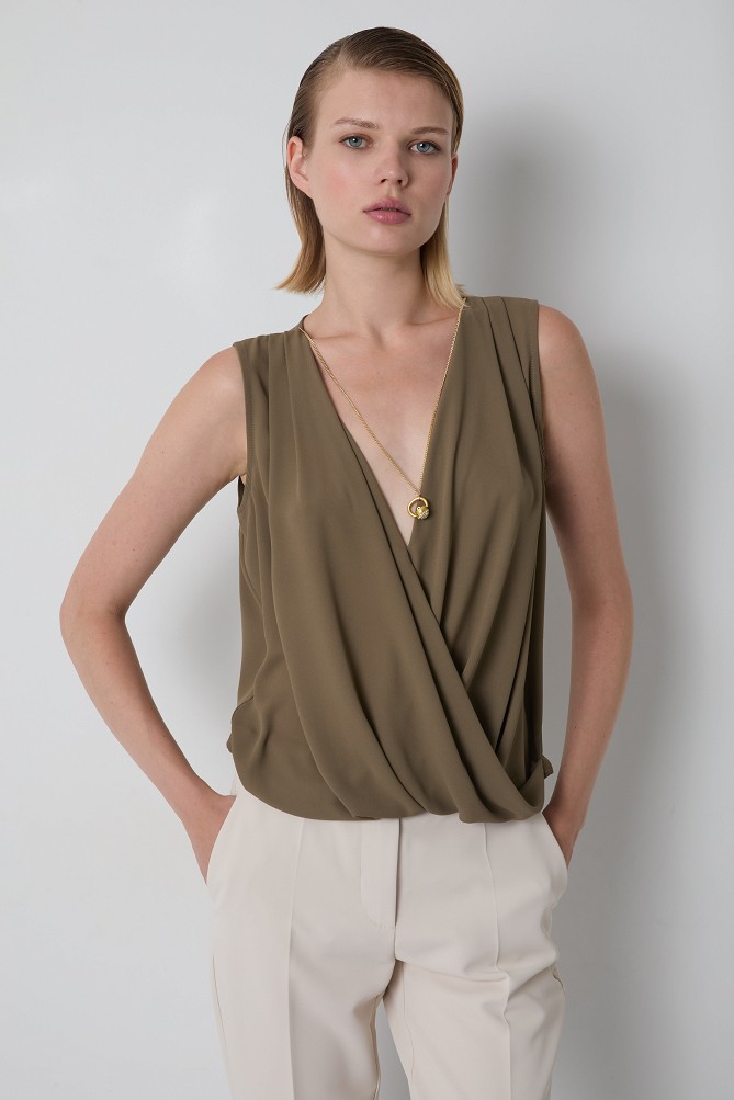 Sleeveless wrap blouse with a necklace detail