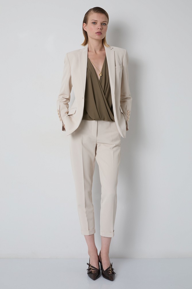 Sleeveless wrap blouse with a necklace detail