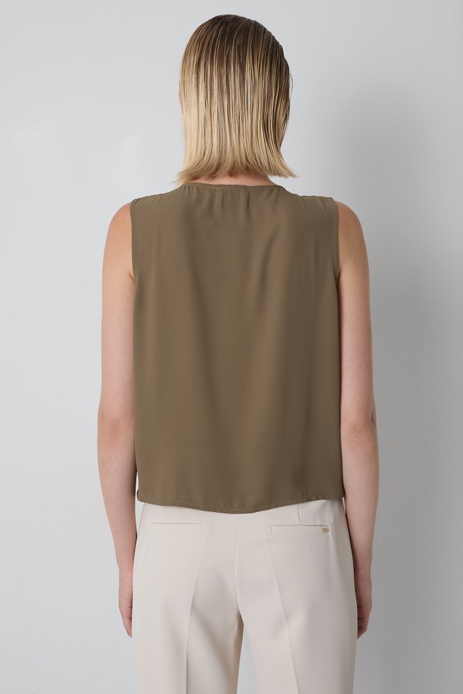 Sleeveless wrap blouse with a necklace detail