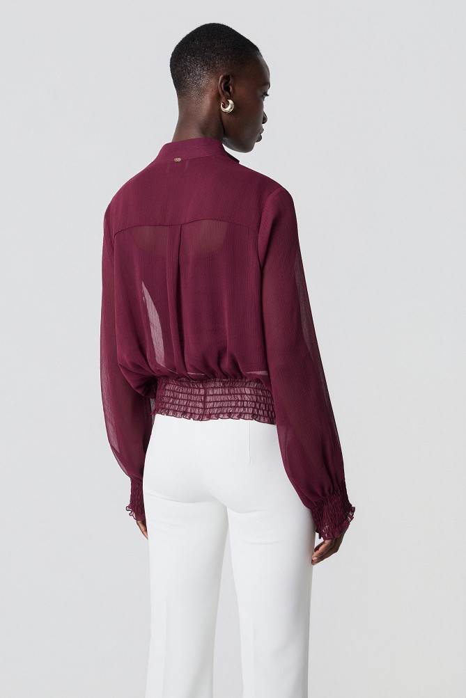 Semi-sheer top with smocked details