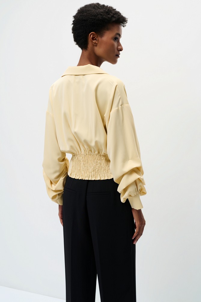Cropped blouse with decorative buttons
