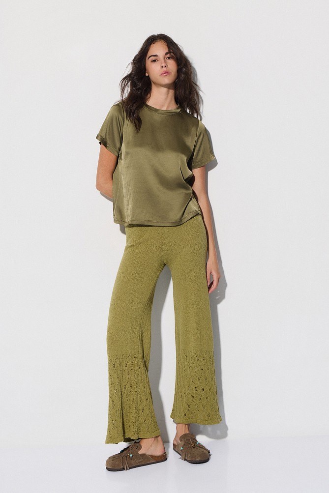 Knitted trousers with cut-work detailing
