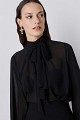 Muslin blouse with a tie-neck detail