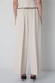 Pleated trousers with an elasticated waistband
