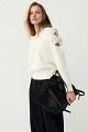 Sweater with bow and rhinestone embellished sleeves
