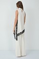 Sleeveless satin turtleneck top with asymmetrical lace hem