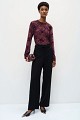 Sheer top with raised floral details