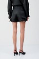 Leather-effect shorts with ruffle detailing
