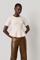 Pulover stil peplum cu decolteu cu pietricele