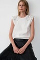 Sleeveless sweater with rhinestone embellishments