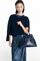 Handbag with asymmetric shape and croc-effect texture