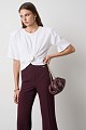 Cropped top with shoulder pads and appliqué flower