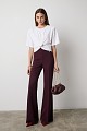 Cropped top with shoulder pads and appliqué flower