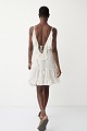 Mini dress with ruffles and open back