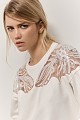 Sweater with motive and beads