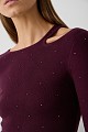 Cut out sweater with rhinestones