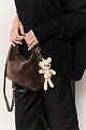 Furry bag with hanging accessory