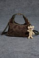 Furry bag with hanging accessory