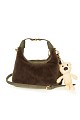 Furry bag with hanging accessory