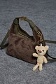 Furry bag with hanging accessory