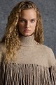 Knitted fringed cape