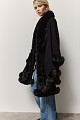 Knitted cape with faux fur