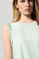 Sleeveless blouse with frill