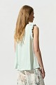 Sleeveless blouse with frill