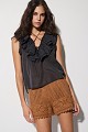 Sleeveless blouse with ruffles