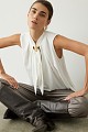 Sleeveless blouse with jewelry