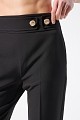 Trousers with bejeweled buttons