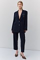 Striped blazer with bejeweled pin
