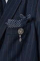 Striped blazer with bejeweled pin